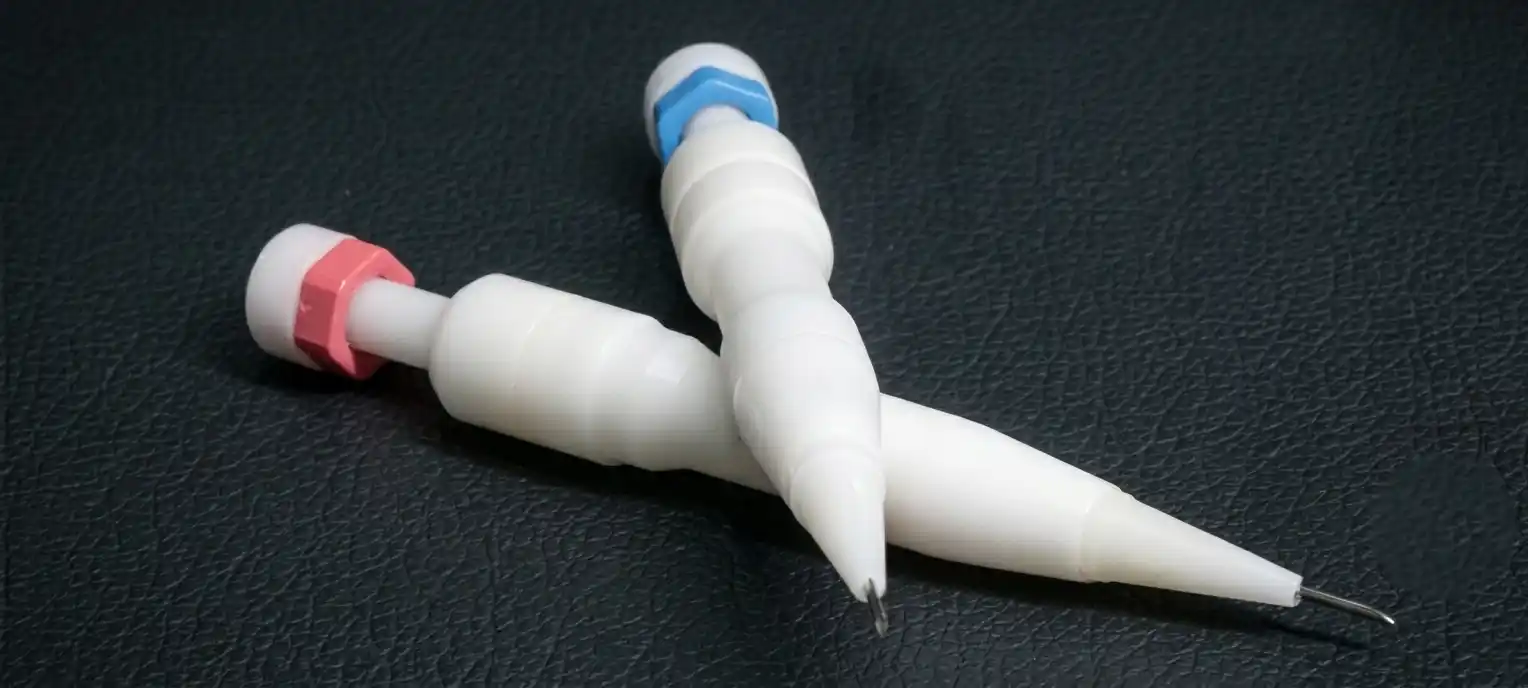 Two sterile Choi implanter pens calibrated for single and double follicular unit placements