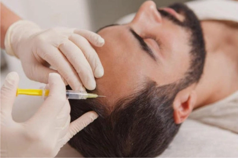 Close up view of medical high frequency glass comb electrode conducting activated oxygen across scalp