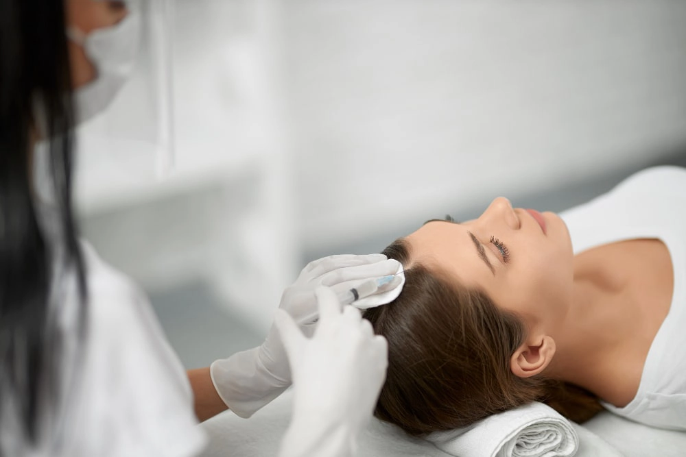 Smiling patient experiencing absolute scalp comfort and revitalized hair texture post medical ozone therapy